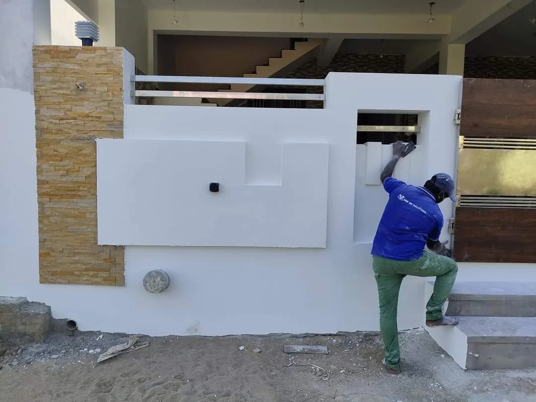 Finished boundary compound wall with natural stone cladding